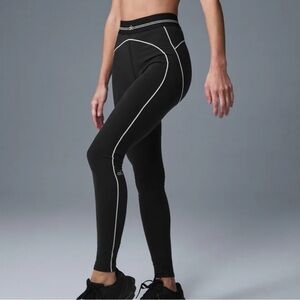 Alo leggings worn with small stain size M